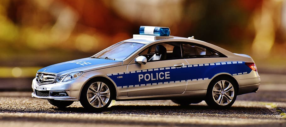 close-up photo of blue and gray police vehicle toy, mercedes benz