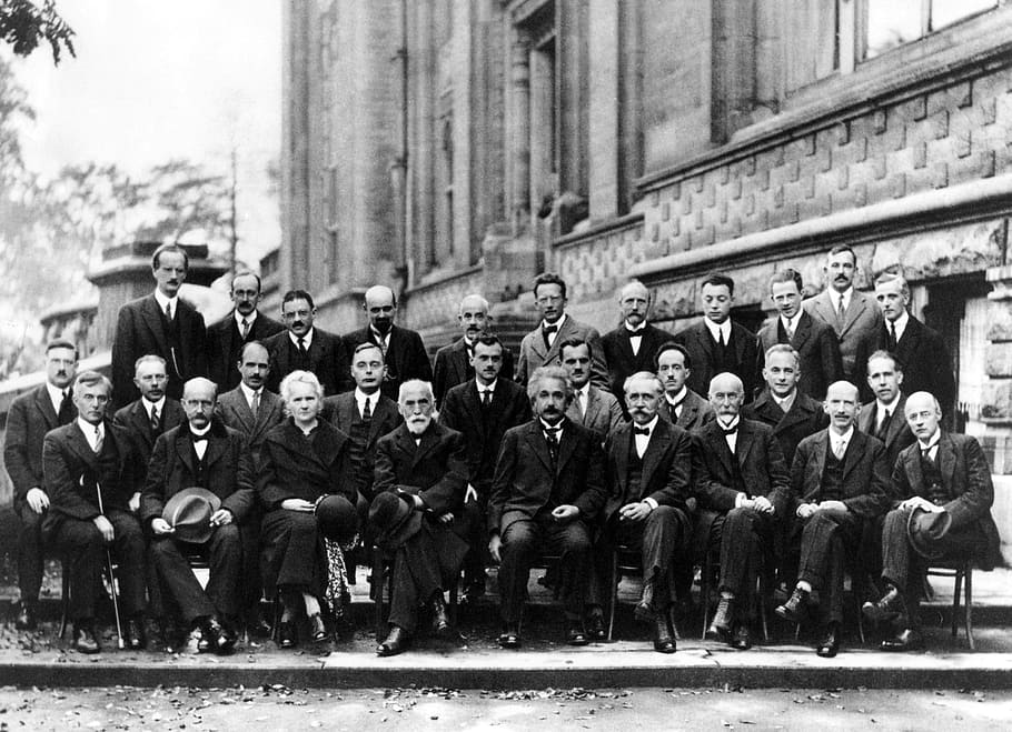 grayscale photo of row of gentlemen sitting chair, einstein, physicist