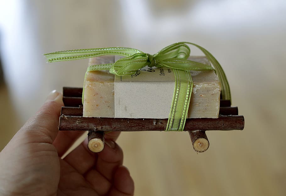 person holding white soap bar on brown raft, Present, Ribbon HD wallpaper