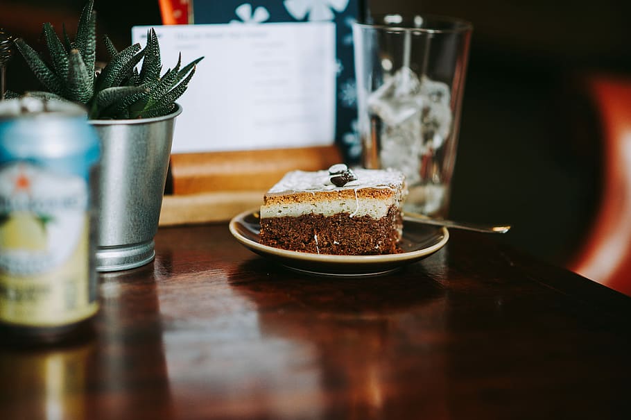 brownies on saucer at table, white icing-covered cake slice on saucer HD wallpaper