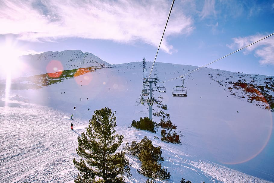 Ride Above, aerial photography of ski lift near people at daytime HD wallpaper