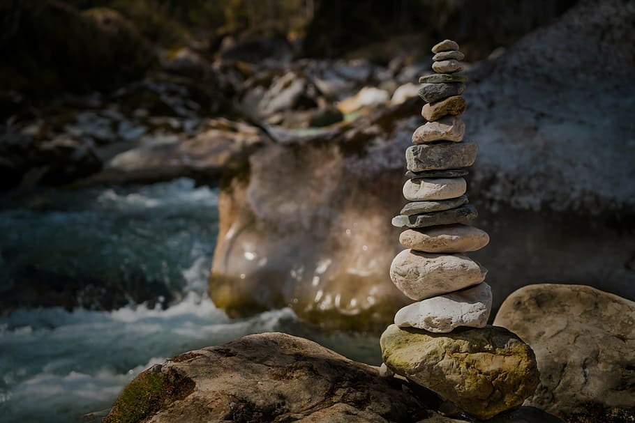 beige stacked stones near body of water at daytime, nature HD wallpaper