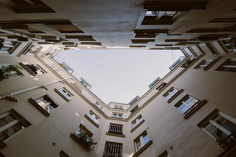 white concrete building low angle photography, low angle photography of highrise building HD wallpaper