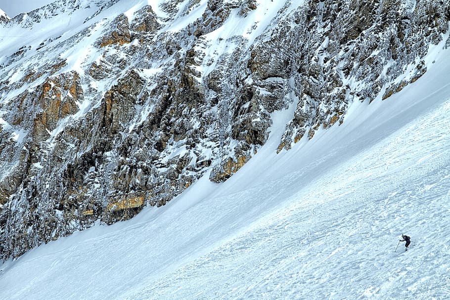 man skiing on ice, person hiking on snow mountain, rock, cliff HD wallpaper