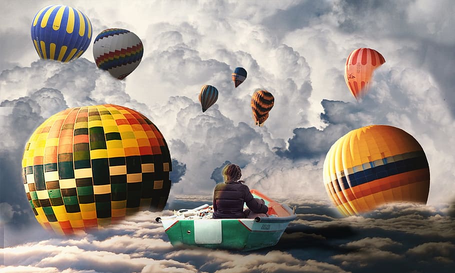 boy sitting on boat surrounded by hot air balloons painting HD wallpaper