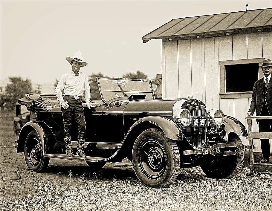 man standing beside convertible vehicle, automobile, antique