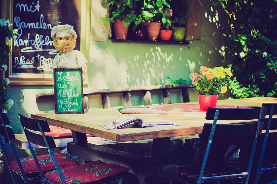 dining table with menu board and flower on top, green chalkboard on brown table HD wallpaper