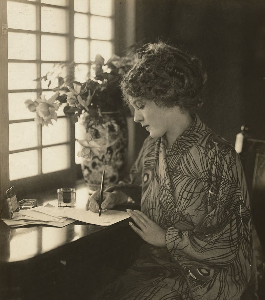 sepia photo of woman writing on paper, mary pickford, vintage