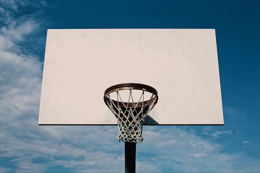 white basketball hoop, white and black basketball hoop under blue sky