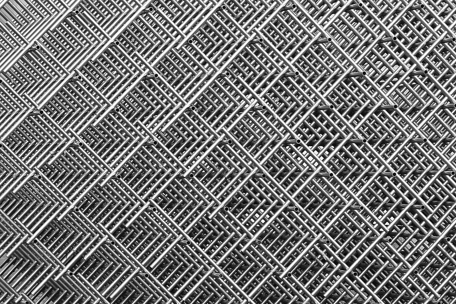 photo of gray metal artwork, grid, wire mesh, stainless rods