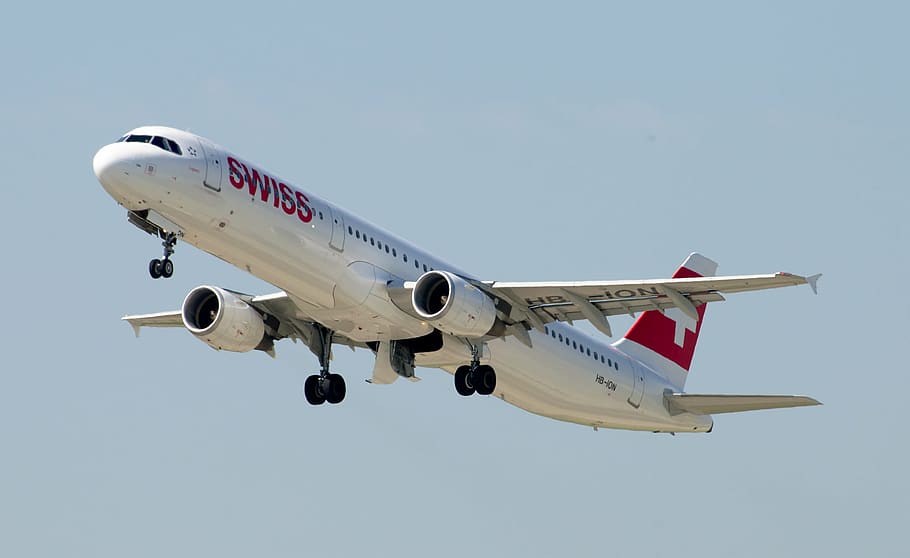 white and red Swiss airplane in sky, airbus a321, swiss airlines