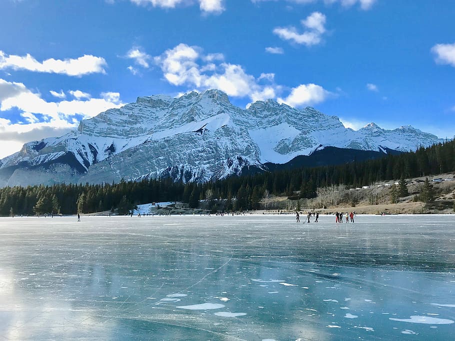 Nature’s Skating Rink, people walking beside body of water under cloudy sky HD wallpaper