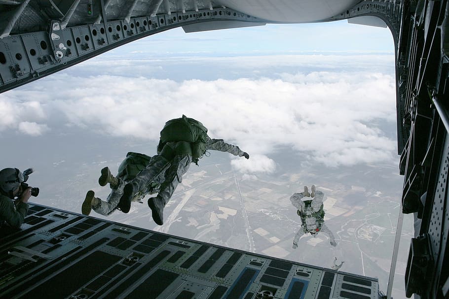 three people in grey army suit sky diving, parachute, skydiving