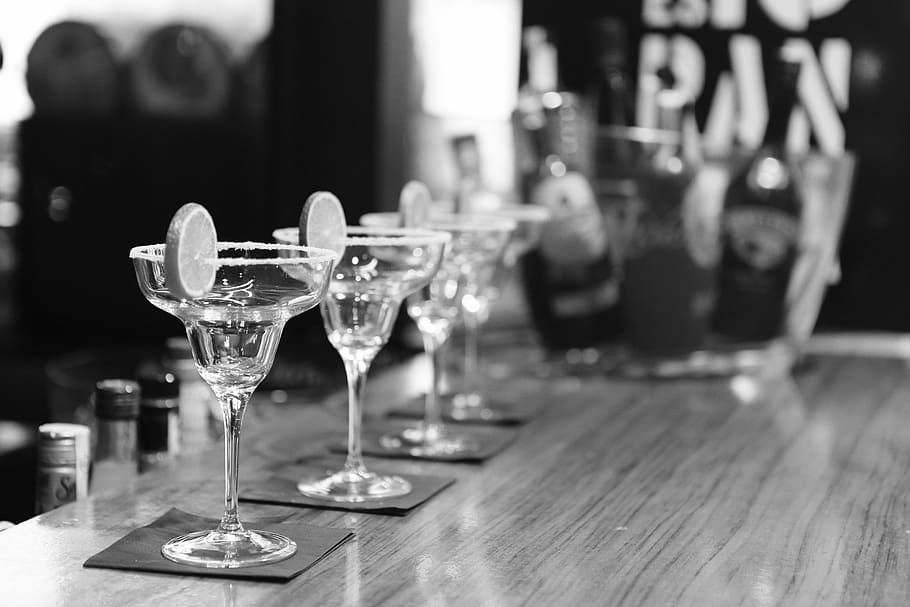 four clear glass martini glasses, bar, cocktails, pub, alcohol