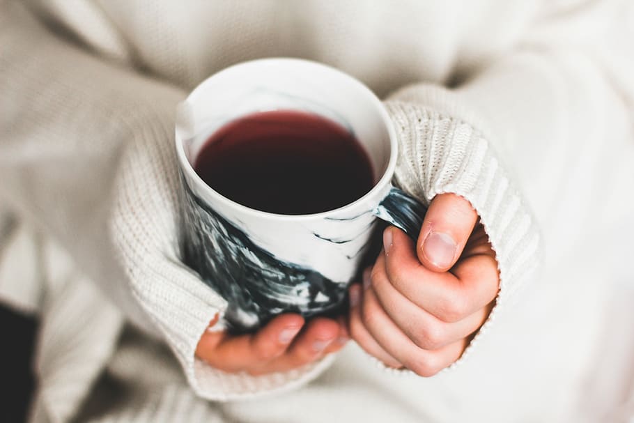 person holding cup of coffee, person holding beverage filled white and black ceramic mug HD wallpaper