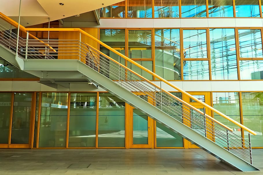 orange metal staircase railing, architecture, interior design