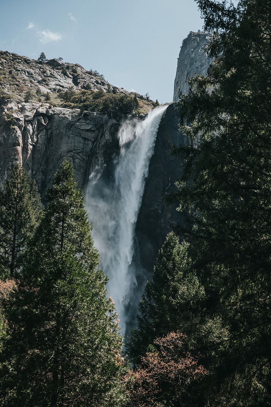 waterfalls surrounded with trees and mountain, waterfalls on gray stone mountain near forest HD wallpaper