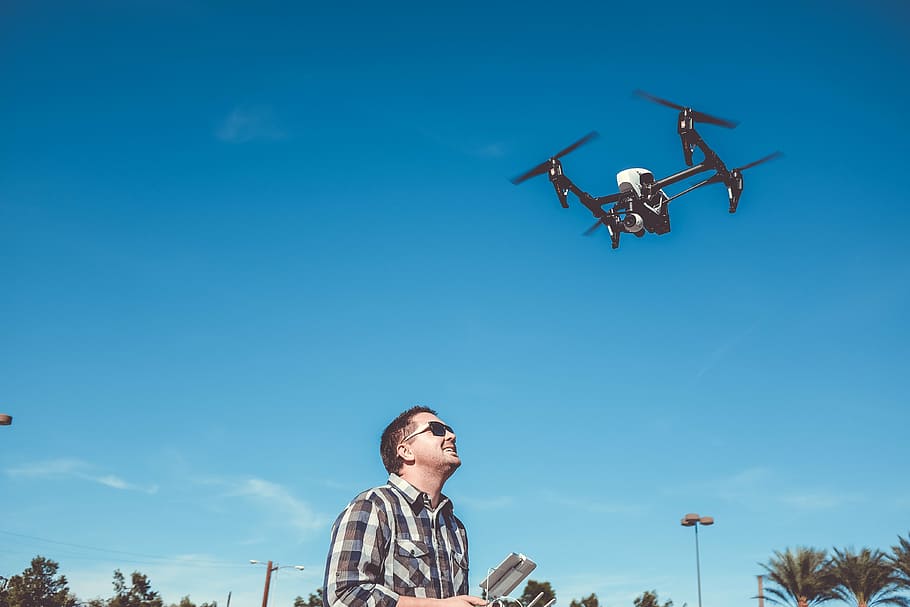 person controlling DJI Mavic Pro, flying, camera, drone, gadget HD wallpaper