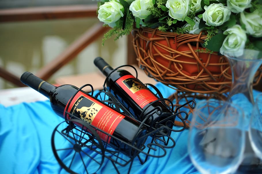two black wine bottles in black metal racks, buffet, wedding HD wallpaper
