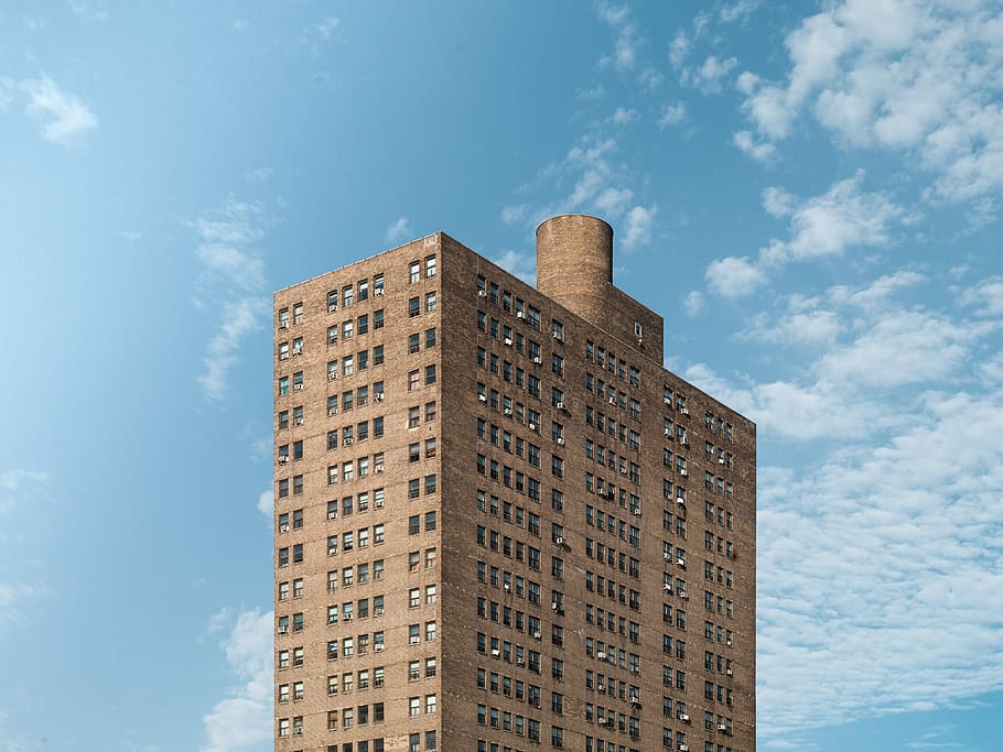 brown apartment-type building, brown concrete building at daytime HD wallpaper