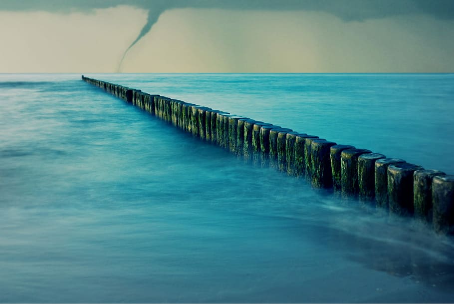 hurricane near wooden barrier along the sea canvas painting HD wallpaper