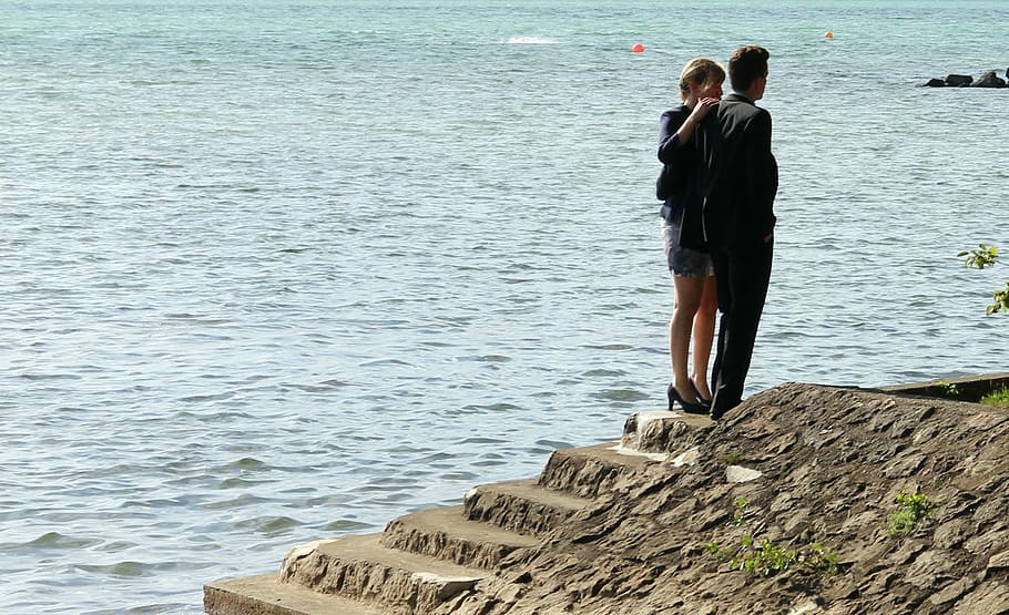 man and woman standing on stairs near body of water during daytime, HD wallpaper