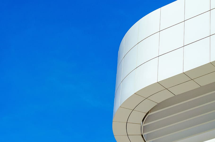 low angle photography of white concrete building at daytime HD wallpaper