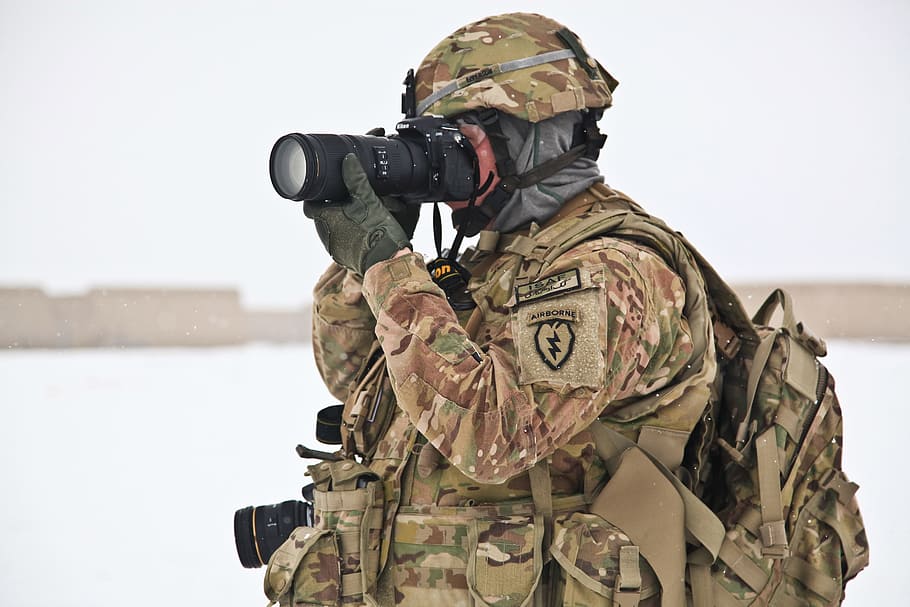 soldier wearing brown and green camouflage uniform looking through DSLR camera, HD wallpaper