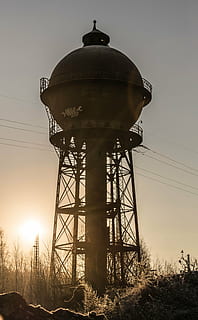 photography of brown metal tank with post at daytime, tower HD wallpaper