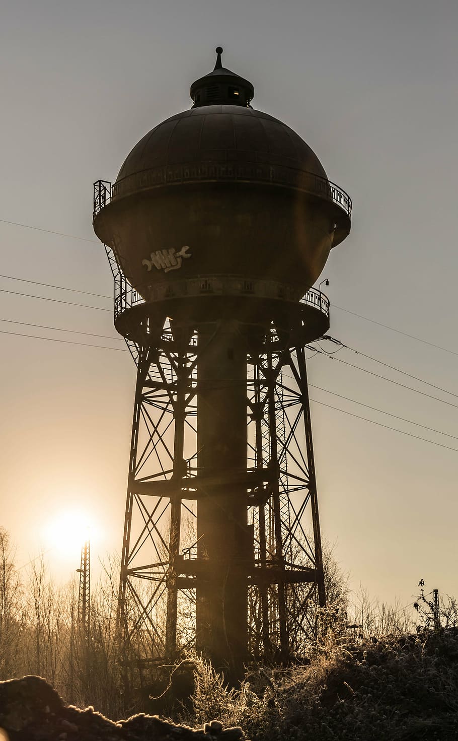 photography of brown metal tank with post at daytime, tower HD wallpaper