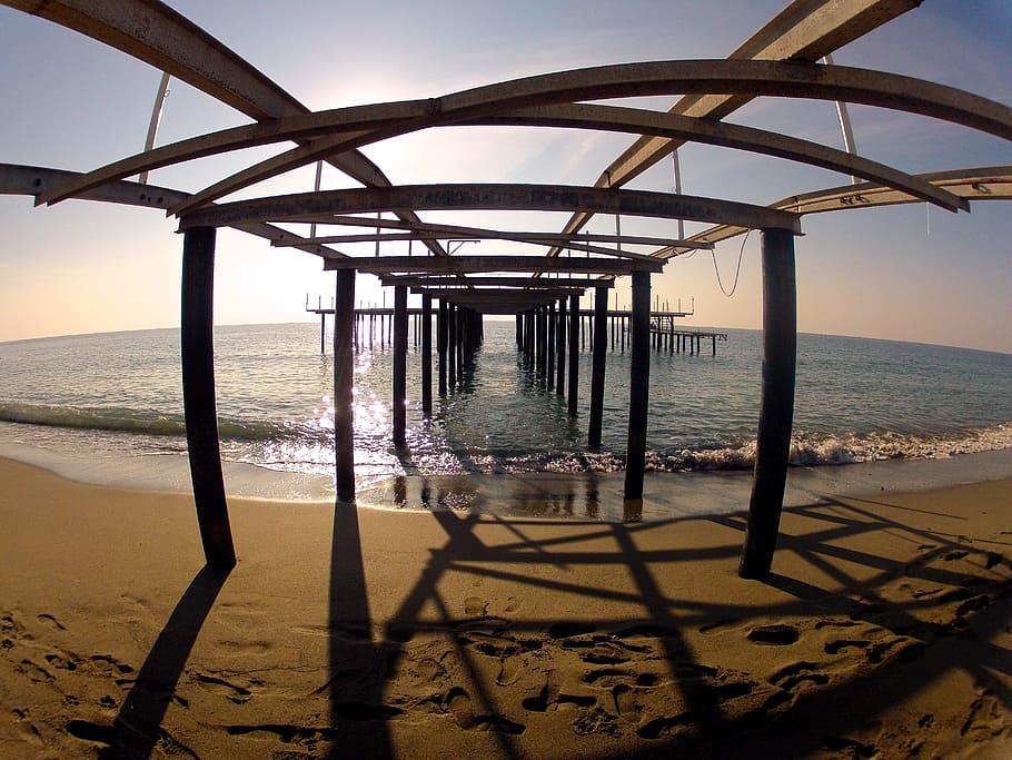 sea, beach, sand, water, decay, ocean, pier, sky, horizon over water HD wallpaper