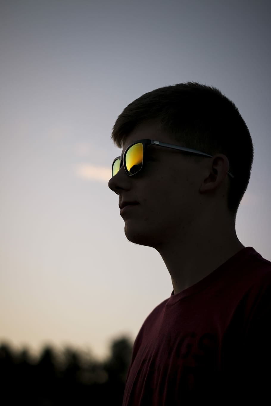 shallow focus photography of man wearing sunglasses, man standing while looking sideway HD wallpaper