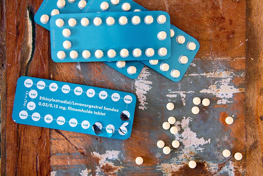 four blue blister packs, pills, tablets, packet, wooden, text HD wallpaper