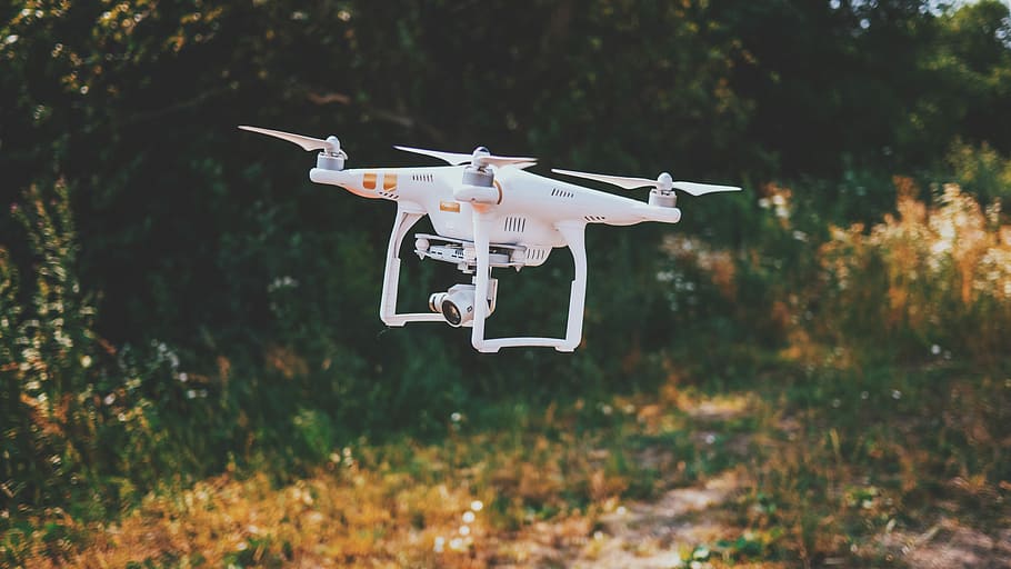 white drone flying outdoor during daytime, white Dji Phantom 3 drone flying above gras s HD wallpaper
