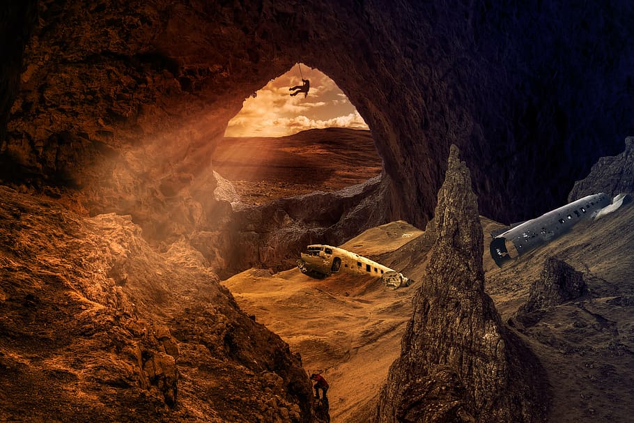 person cliff hanging inside cave, boneyard, airplane, aircraft