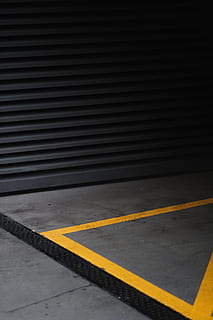 gray and yellow concrete flooring, grey roll-top gate, street HD wallpaper