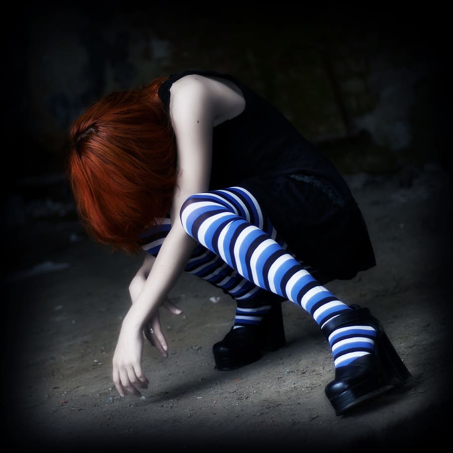 woman in black dress with pair of blue and white striped socks anime