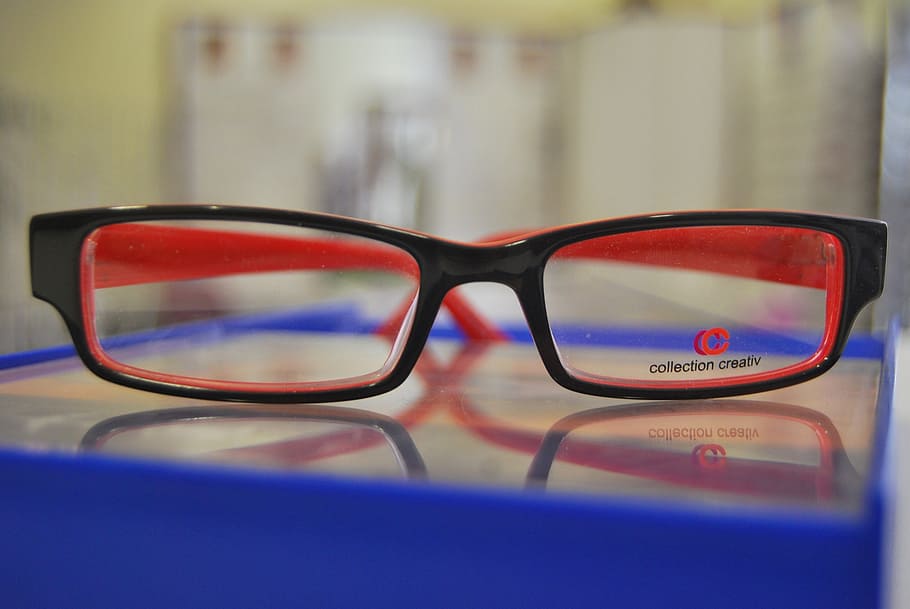 eyeglasses with black frames on shallow focus lens, optics HD wallpaper