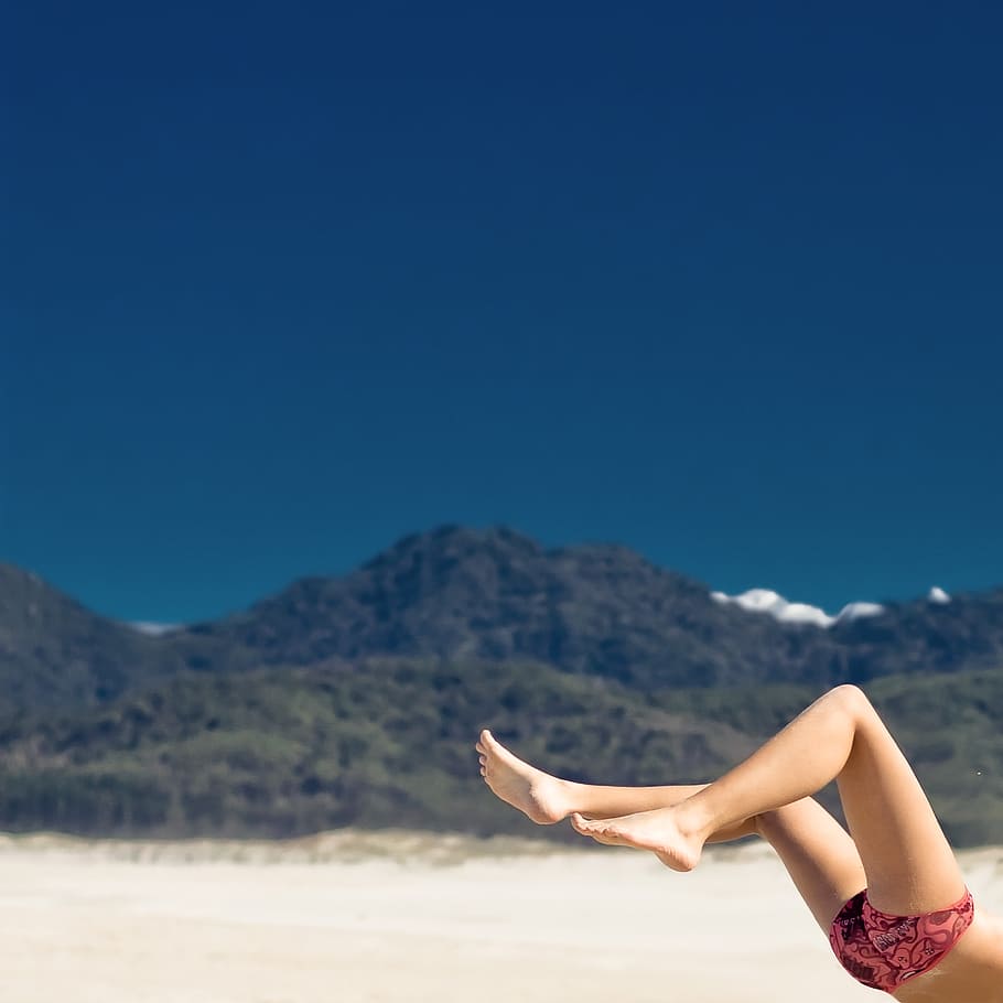 selective focus photography of woman on seashore, person near seashore and mountain, HD wallpaper