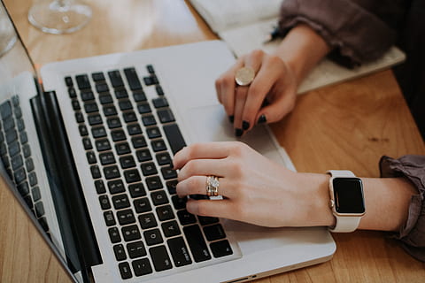 person using MacBook, person in silver ring holds a MacBook Pro HD wallpaper