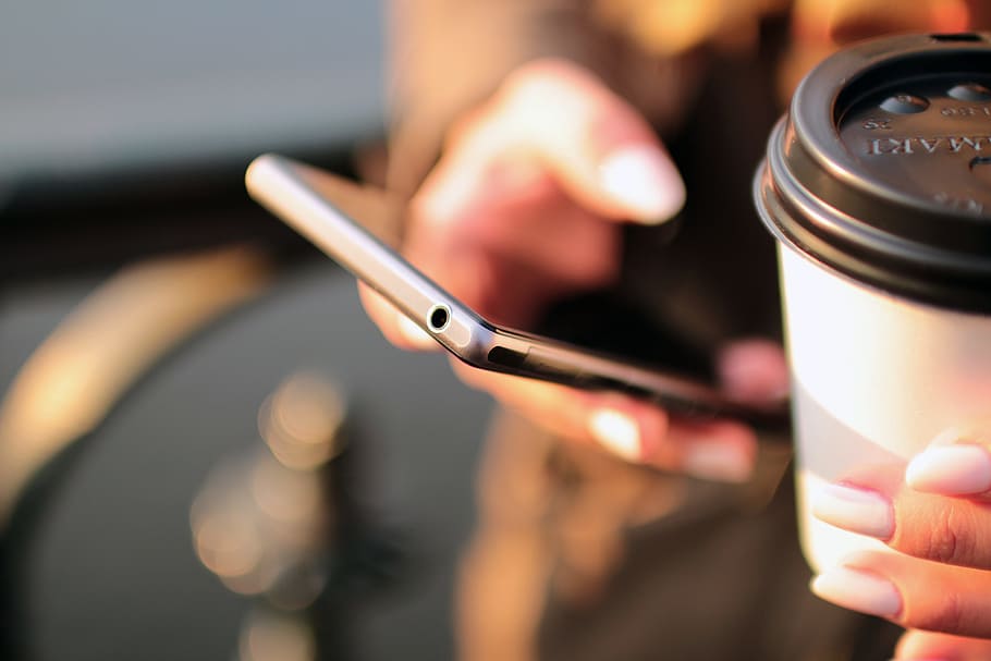 person holding smartphone and tumbler, mobile, technology, coffee HD wallpaper