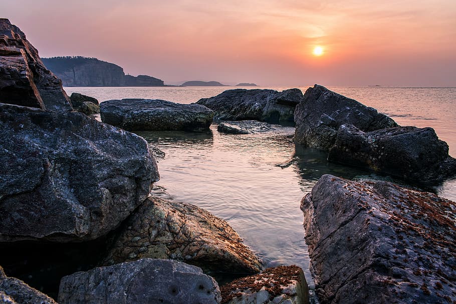 rocky shore during sundown, stone, beach, sunset, yantai, long island, HD wallpaper