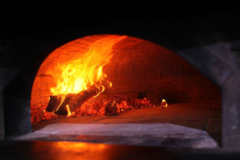 wood burned with flame inside brick oven, wood fired oven, pizza