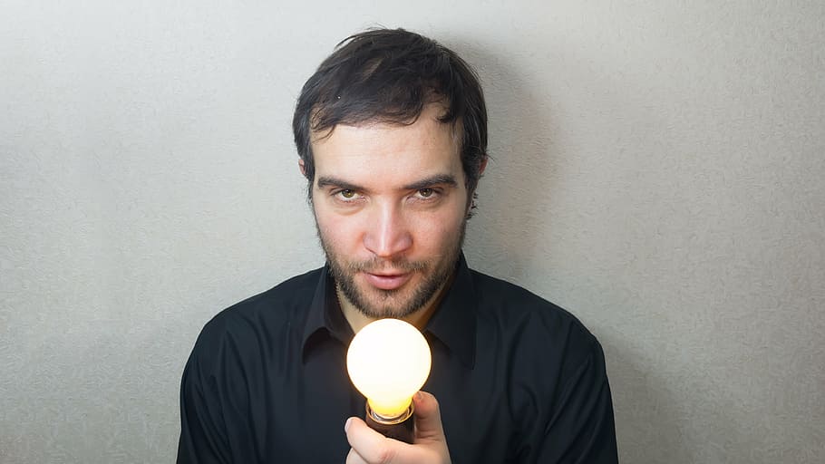 man holding lighted lightbulb, idea, concept, bright, burns HD wallpaper