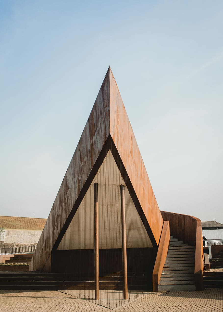 pyramid-shaped building, brown concrete house, stairway, architecture