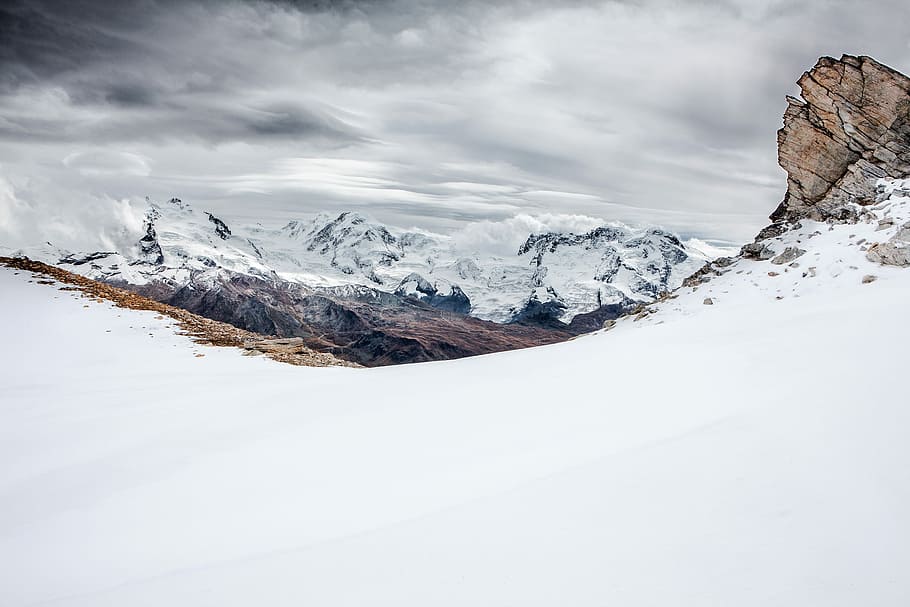 brown mountain covered with snow under dark cloudy sky, snow-covered mountain under cloudy skies HD wallpaper