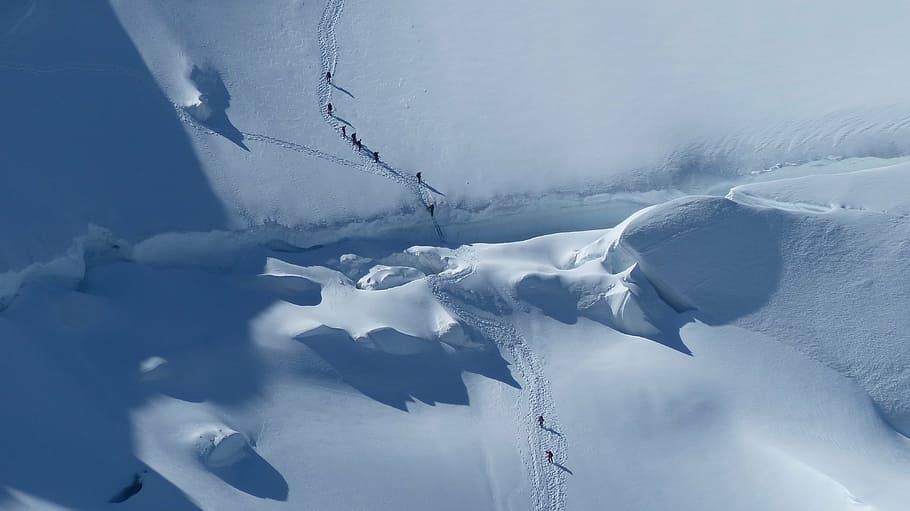 aerial photography of people walking on snowy terrain, glacier HD wallpaper