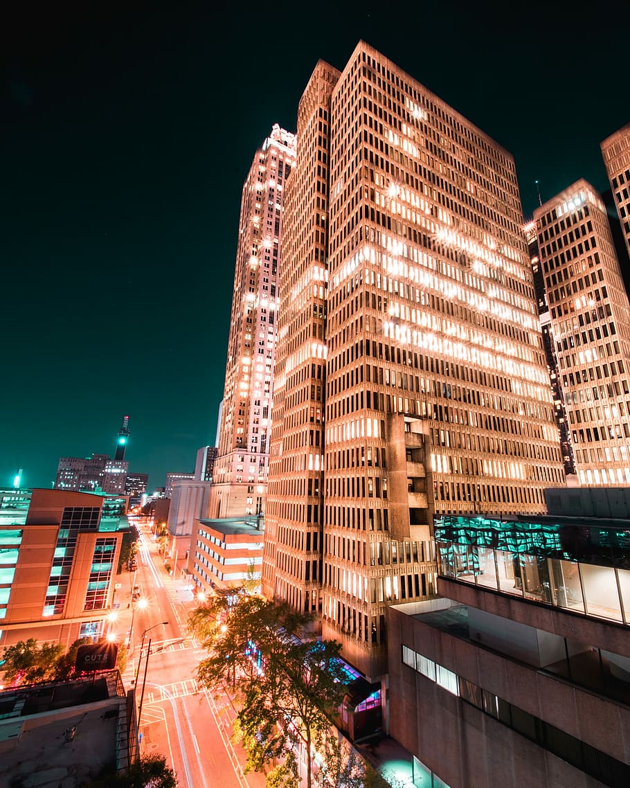 orange high-rise building with light, worm's eye view of building HD wallpaper