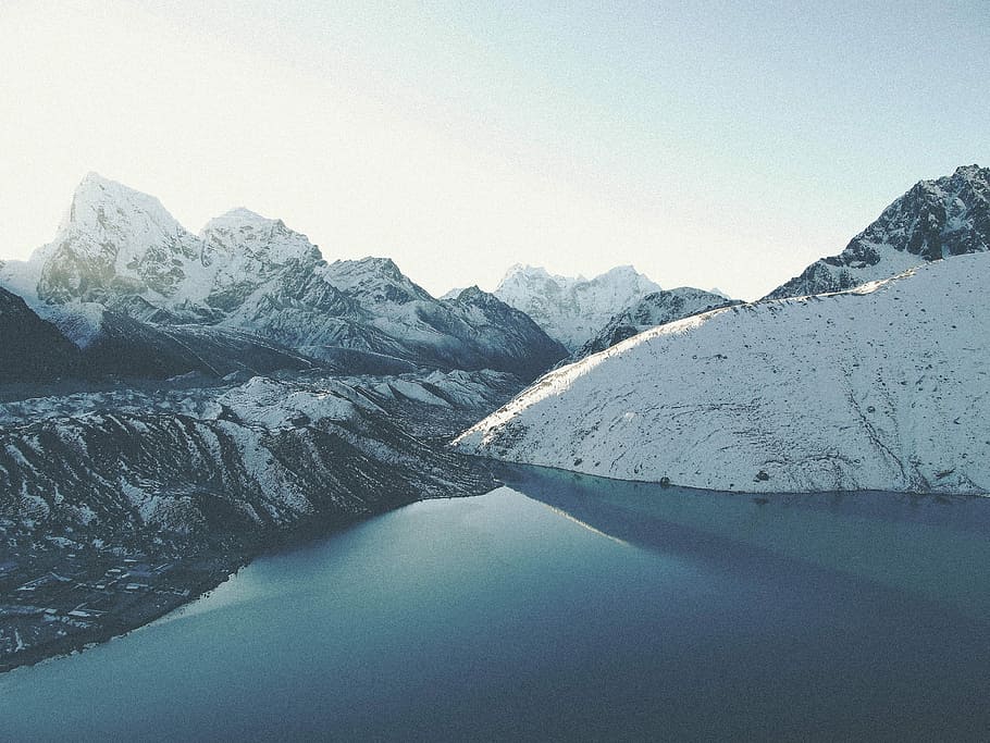 ice covered mountain photography, body of water beside mountain filled of snows HD wallpaper