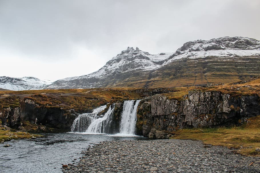 waterfalls and high mountain under cloudy sky, waterfall during daytime HD wallpaper